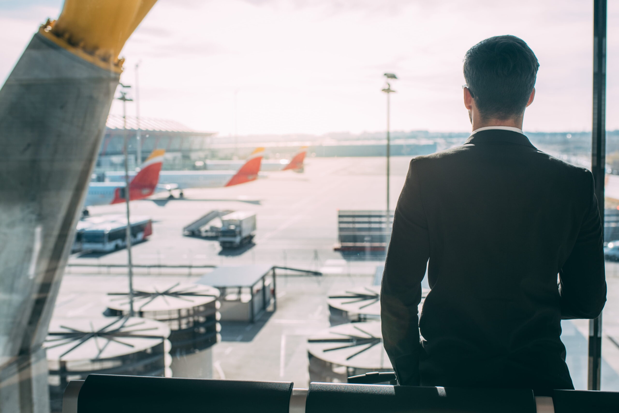 Airport manager looking over runway